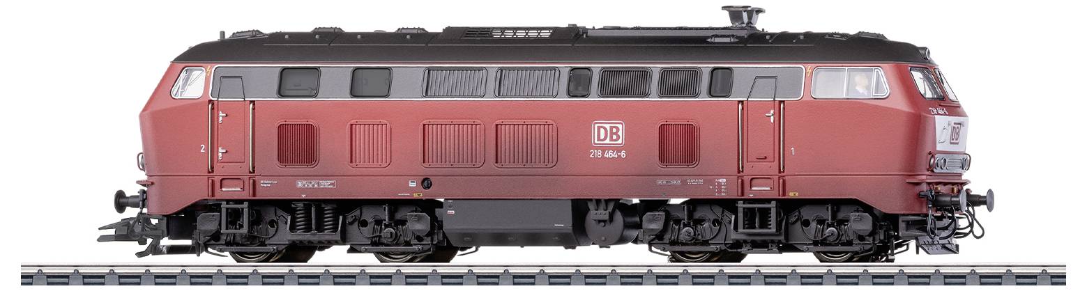 Red locomotive of the German Railways on a track, focusing on the side view and details of mechanical components.