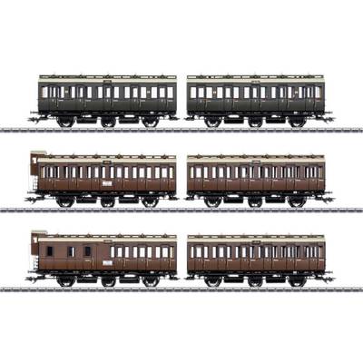 Historic railway carriages in three different colours on railway tracks, a detailed representation of the carriages' form and design.