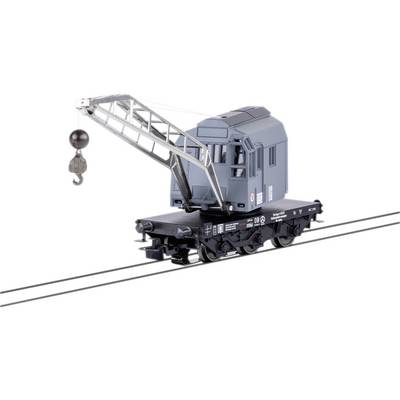 Toy model of a railway turntable crane in grey on railway tracks. The crane has a hook for lifting loads and is intricately designed.