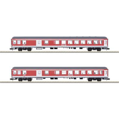 Two red regional trains on the track. The upper train displays a bicycle symbol, the lower one is identical without the symbol. Both have multiple windows.