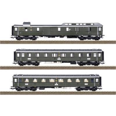 Three green model railway carriages on tracks: A luggage van, a passenger carriage, and a dining car in a historical style.