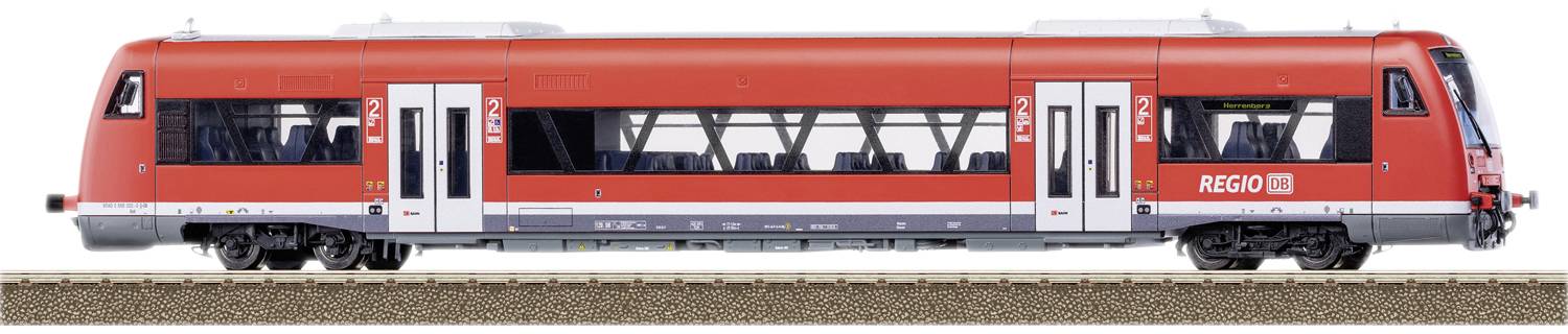 A red regional train from DB Regio is standing on a railway track. The train has multiple doors and windows and is designed for passenger transport.