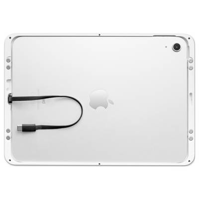 A tablet is lying face down. A USB-C cable is resting on top of it. An Apple logo is visible in the centre.