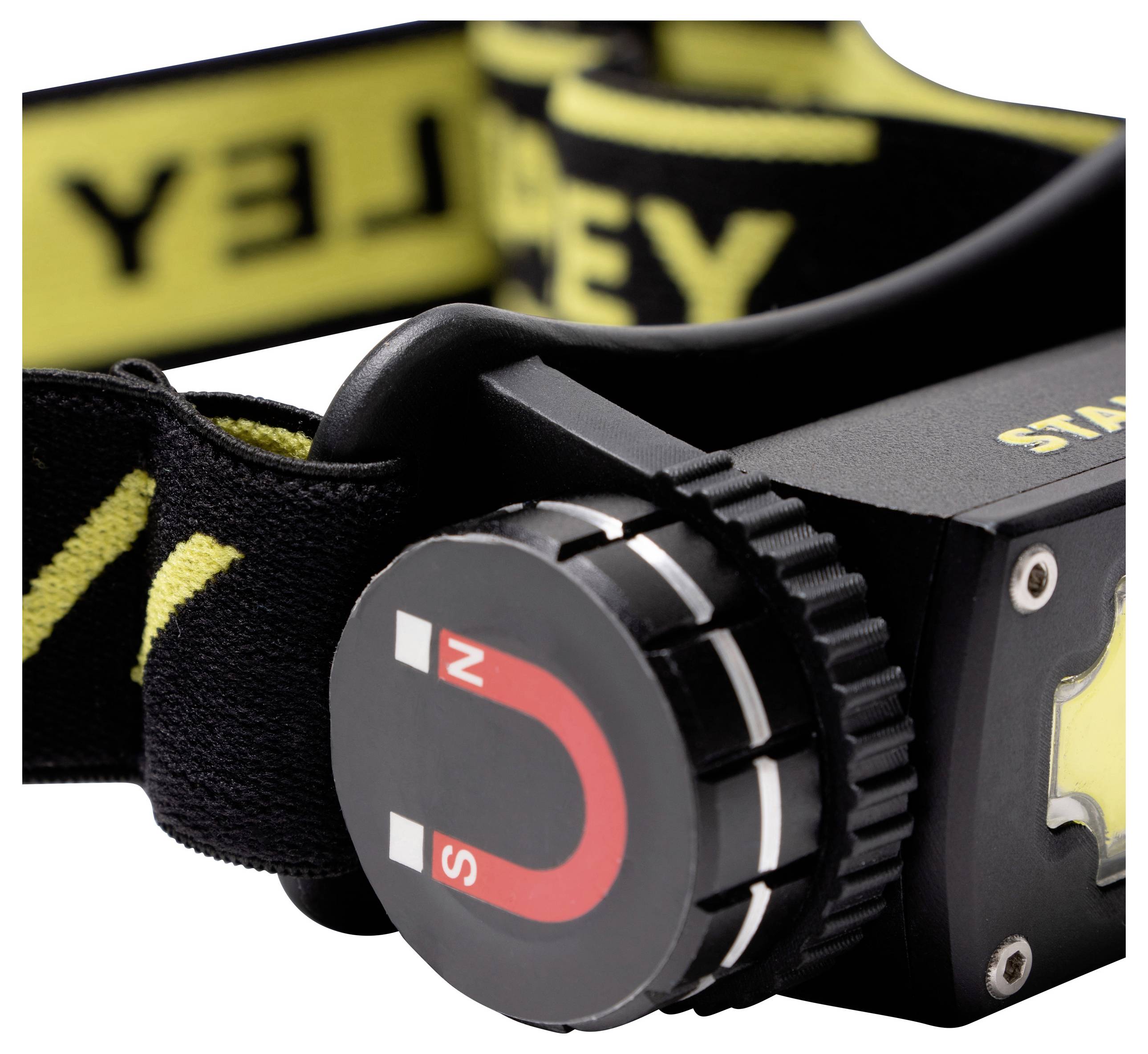 Close-up of a black head torch with a yellow text logo on top and a red magnetic symbol on the side.