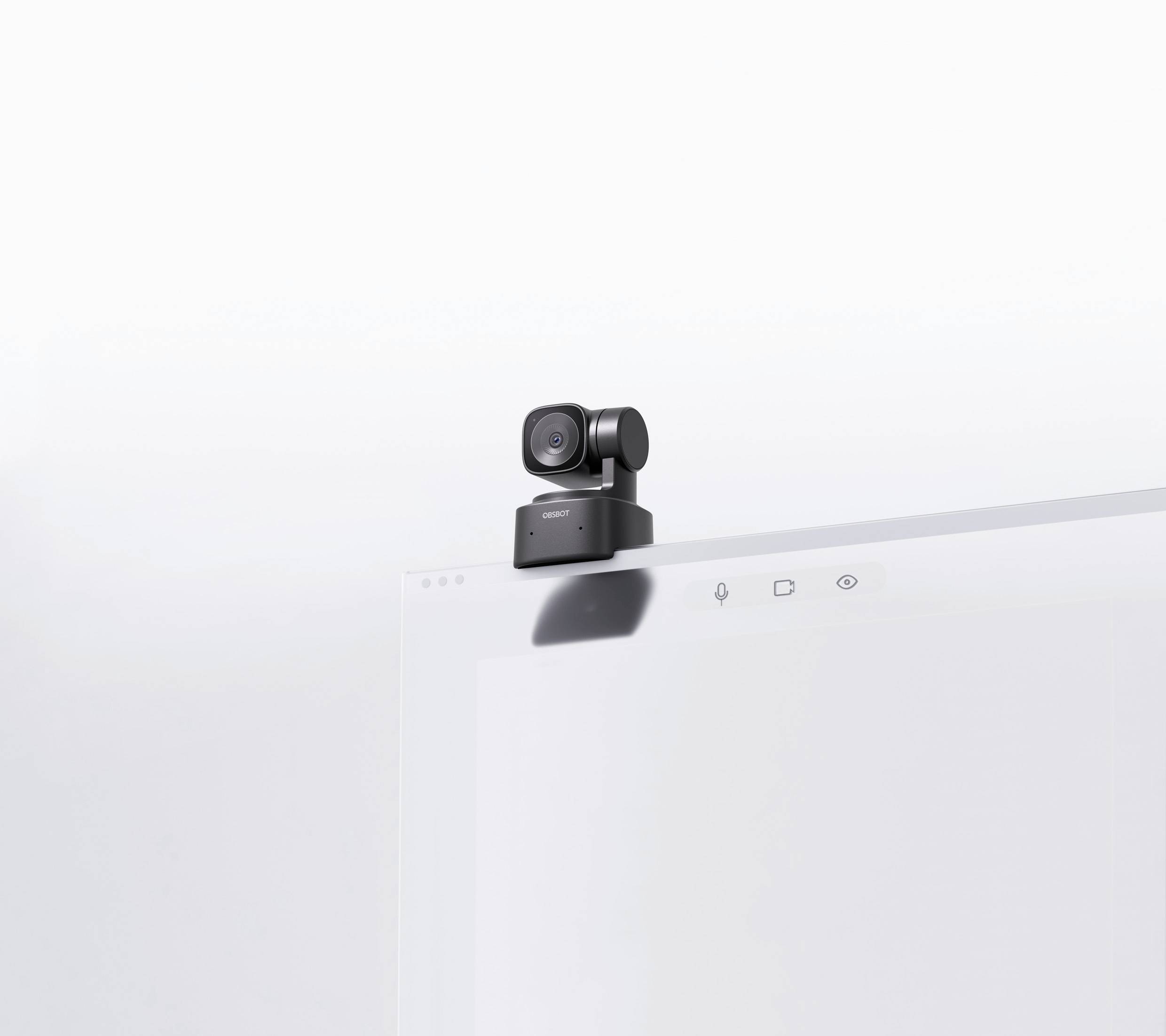 A small camera is located on a modern, thin screen that is likely part of a computer.