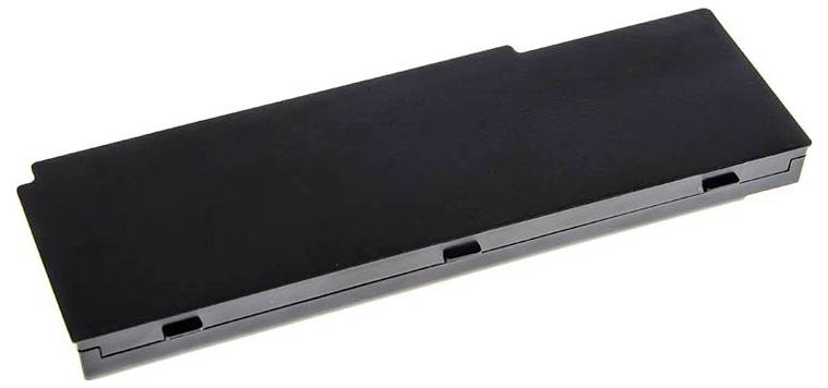A black rectangular laptop battery viewed from above, lying on a white surface.