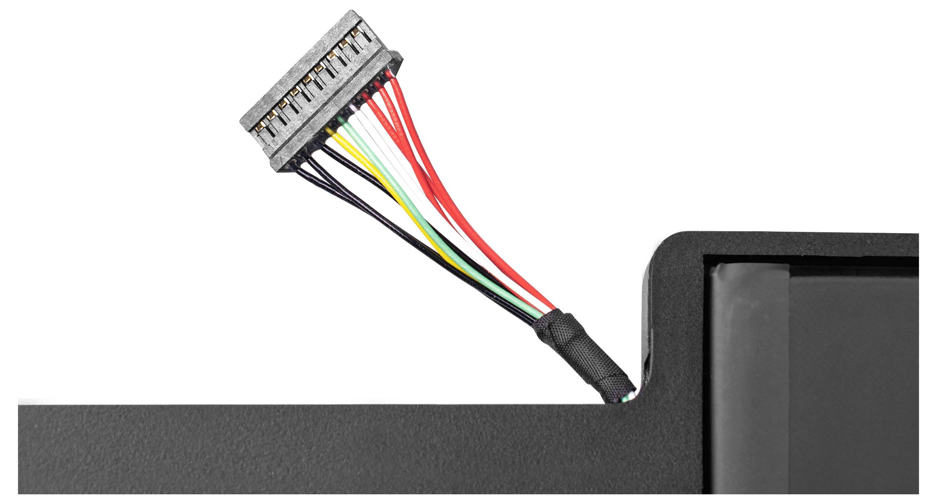 Cable connection with multiple colourful wires, secured to a black plastic surface, showing technical connections.
