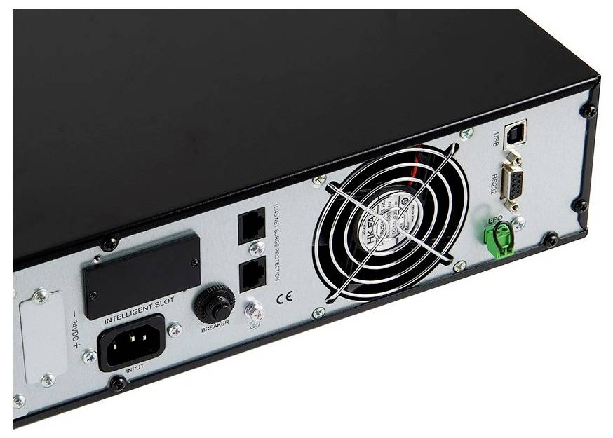 Back of an electronic device with a fan, power connection, and various slots for connections and expansion cards.