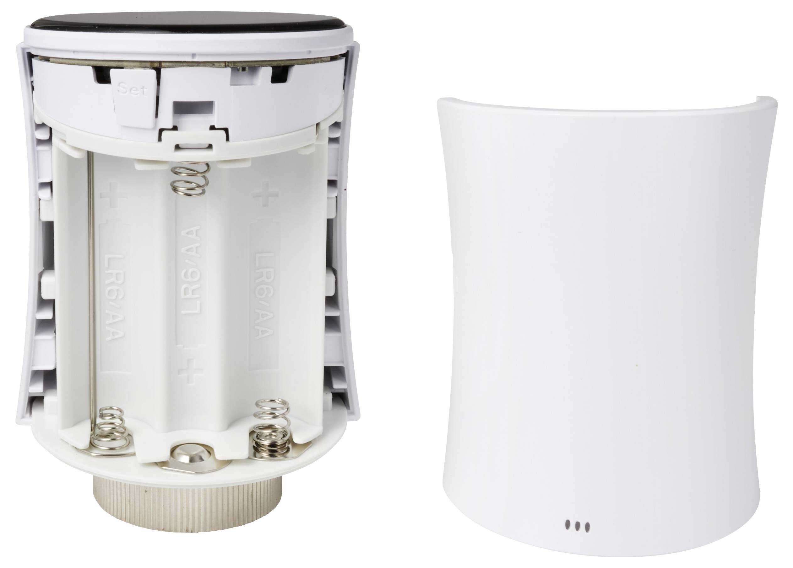 Open battery compartment of a device requiring two AA batteries, alongside the removed device cover.