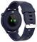 A dark smartwatch with a round case and silicone strap. Green sensors for heart rate monitoring are illuminated on the back.