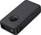 A black power bank with a digital display shows the charging status. It features multiple charging ports.