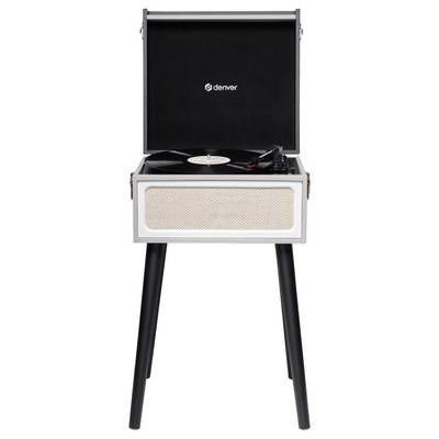 Record player in a wooden cabinet with an open lid, standing on four legs. A vinyl record is being played on it.