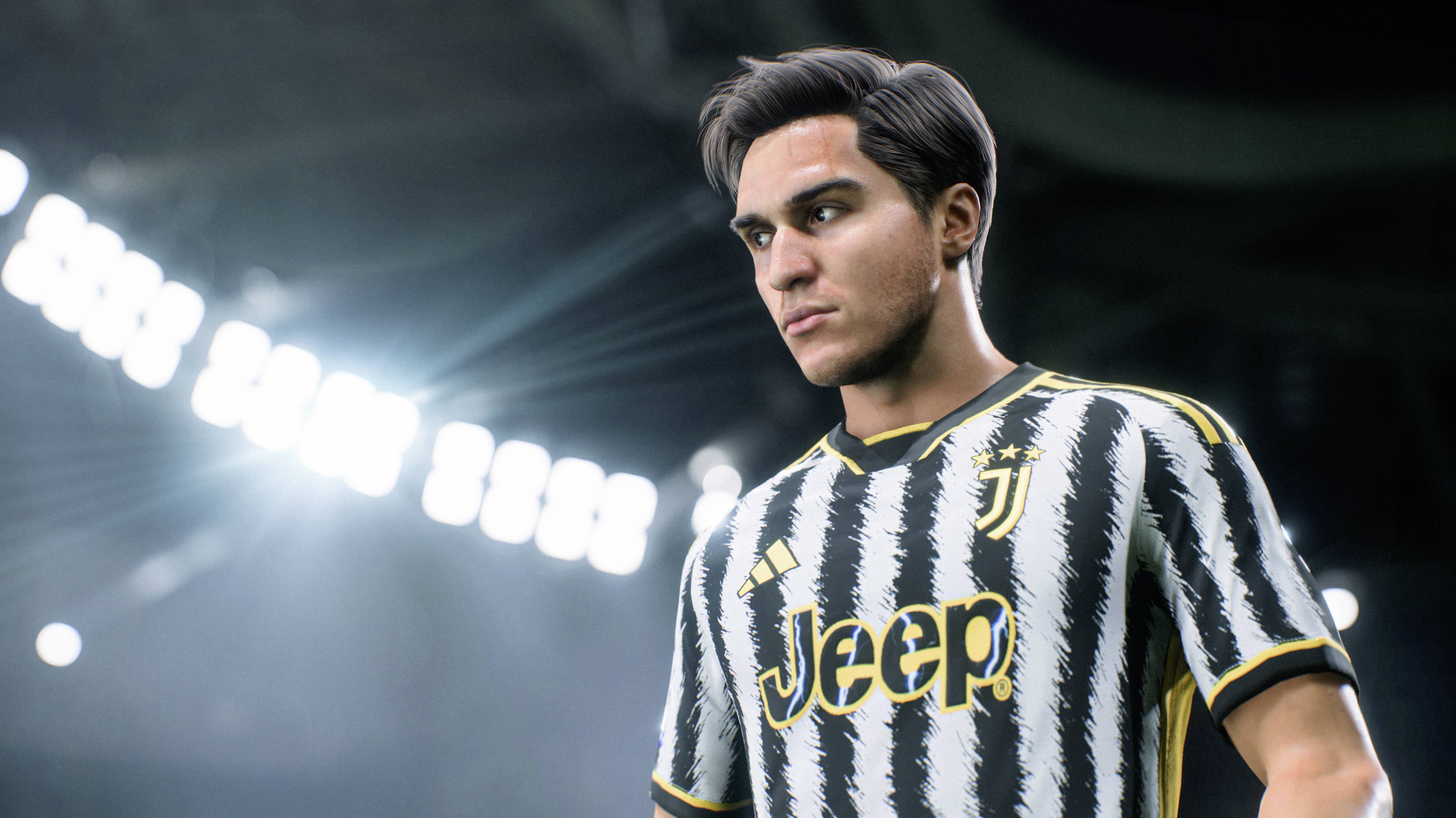 A footballer in a striped jersey with lettering, under bright stadium lights, looks resolutely to the side.