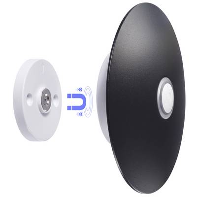 A magnetic wireless charging pad being aligned with its wall-mounted base. Arrows indicate magnetic connection between the two components.