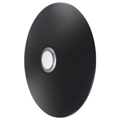 A black circular object with a white button at the center, resembling a sleek, modern speaker or electronic device, viewed from an angle.