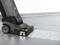A floor cleaning device is cleaning a tiled surface with soapy water. The floor appears half clean and half dirty.