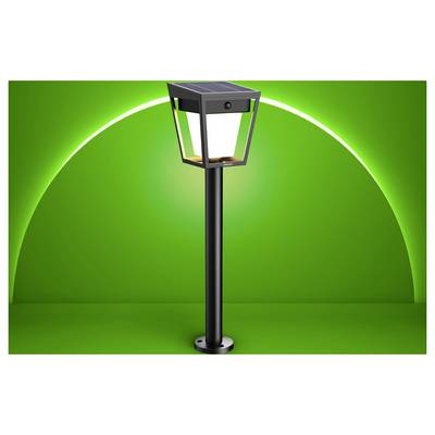 Black outdoor post light with solar panel top, shown against a bright green gradient background.