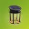 Solar lamp with a cylindrical design on a green background. A solar panel is located at the top. Ideal for eco-friendly lighting.