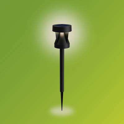 Solar-powered garden light glowing brightly against a green background. Ideal for illuminating outdoor spaces.