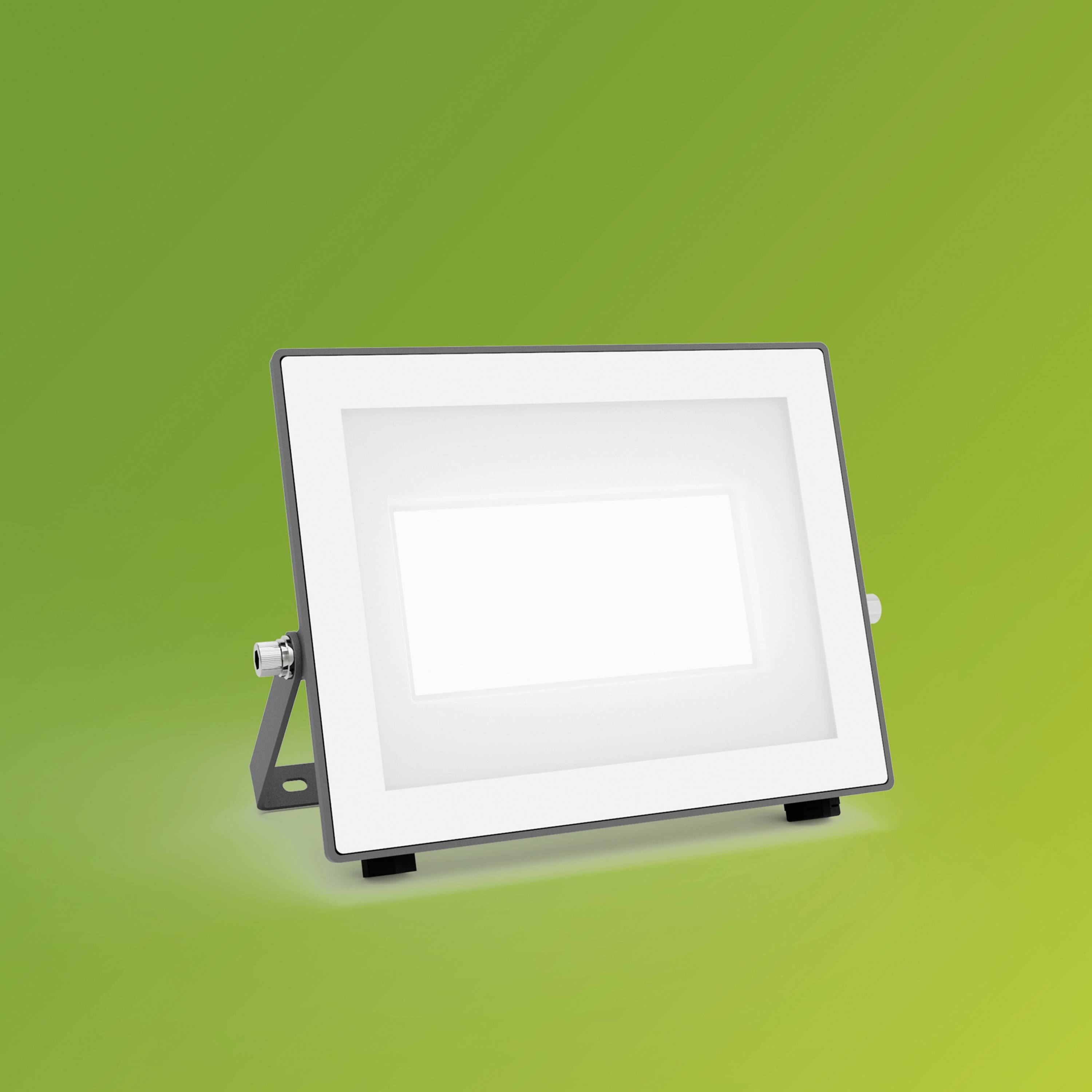 A rectangular LED floodlight with a silver casing and white front cover on a green background.