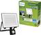 Philips LED floodlight with motion sensor, energy-efficient, packaged in a green box, includes promotional references to energy efficiency.