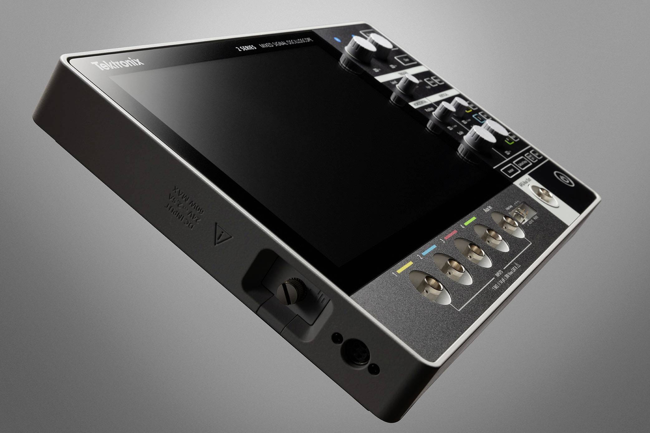 A high-resolution oscilloscope with multiple input and control buttons, viewed at an angle from the side.