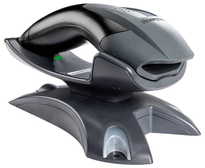 A wireless barcode scanner on a charging and docking station, ready for use.