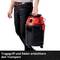 A person is carrying a black and red vacuum cleaner with a carrying handle and wheels. Text: 'Carrying handle and wheels make transportation easier'.