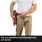 A person is carrying a tool with a clip on their belt to enable quick temporary storage.