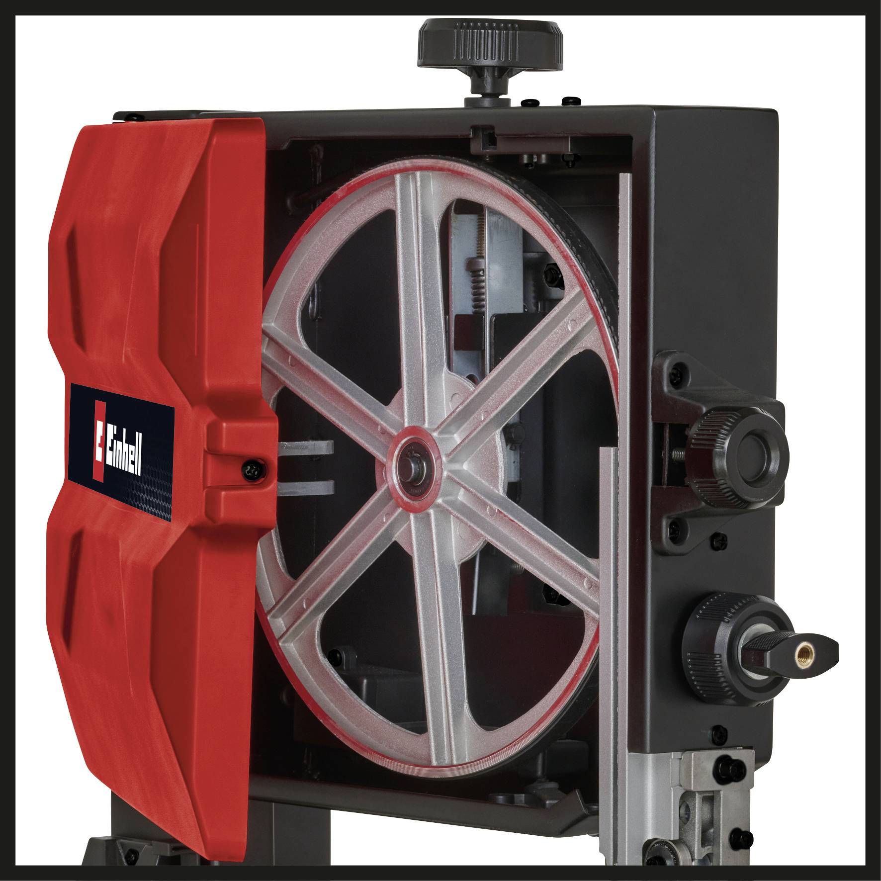 A half-open bandsaw with a visible belt pulley and housing in red and black.
