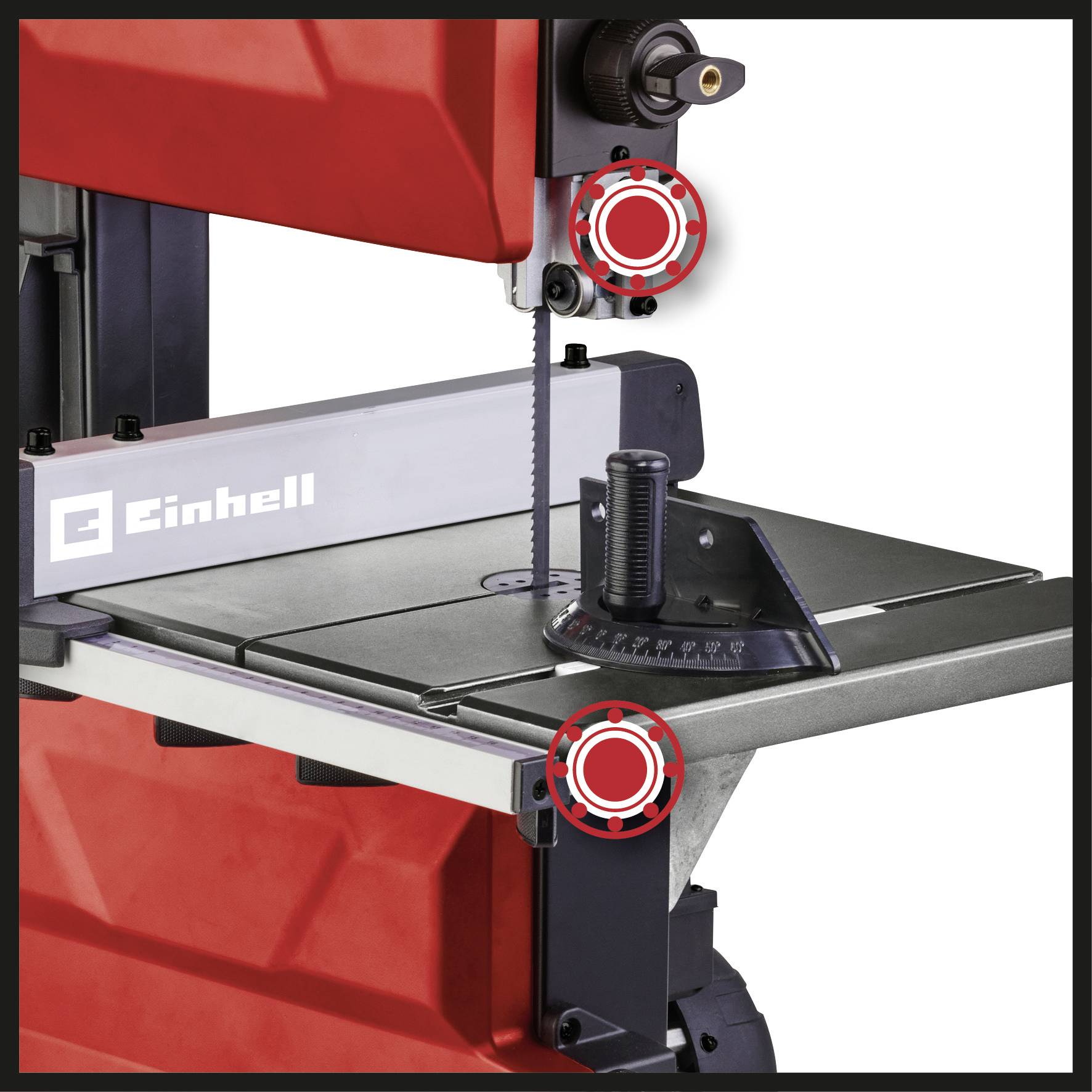 A red band saw with a metal worktable, on which an angle gauge is placed.