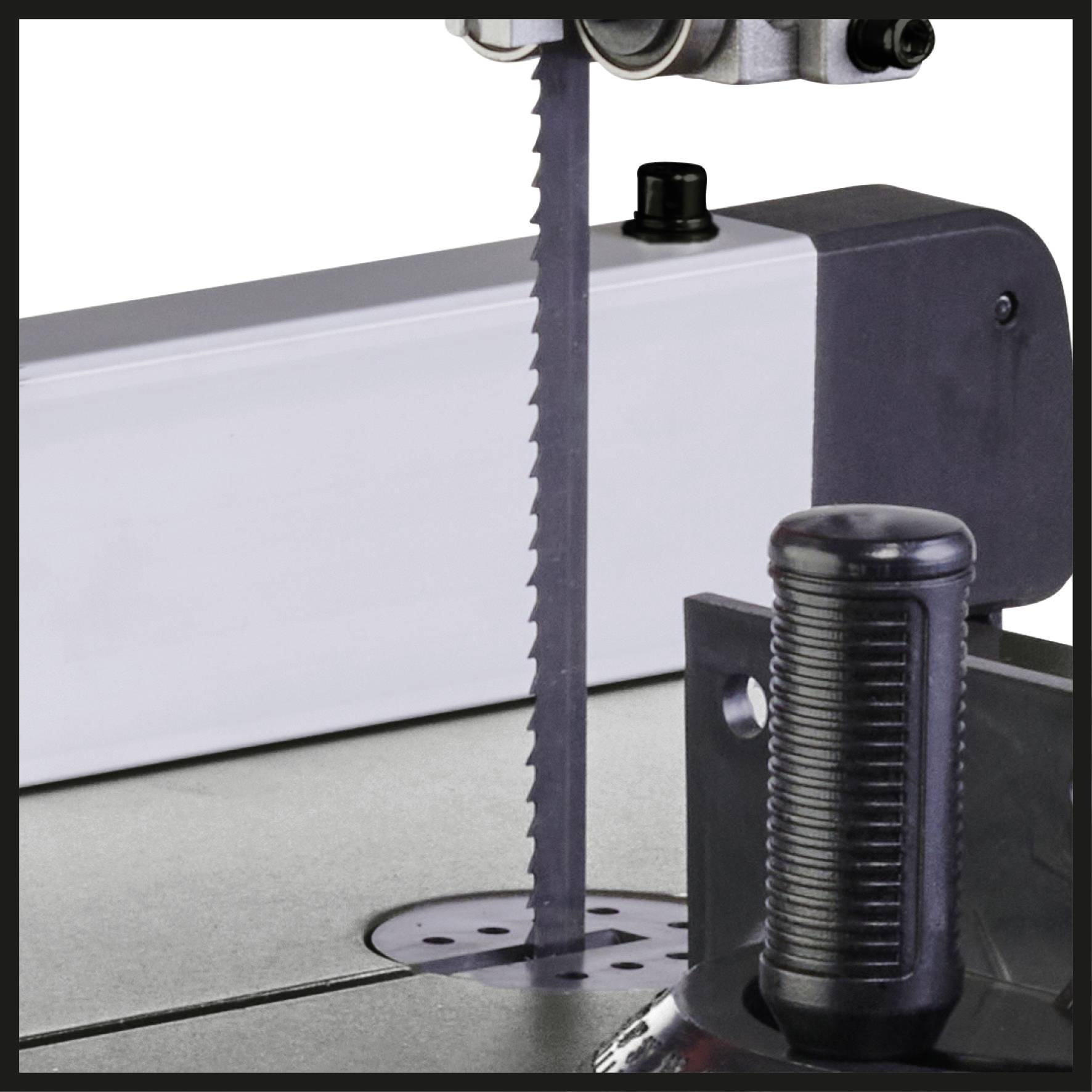 A bandsaw with a sharp saw blade, suitable for cutting wood or metal, in a workshop environment.