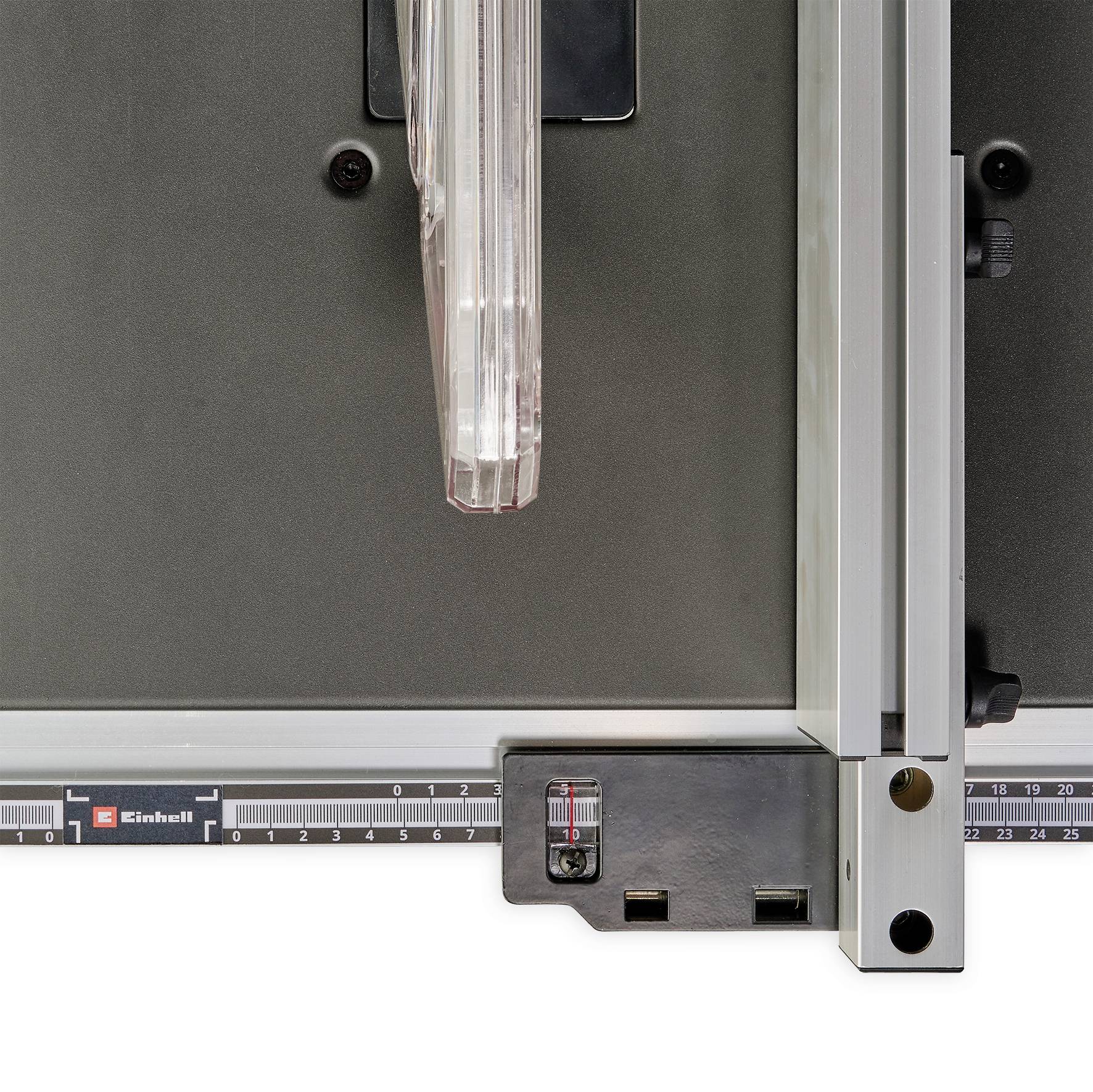 A close-up of a metal ruler and square tool on a table saw, showing precise measurement and alignment features for woodworking.