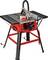 A red and black table saw with a circular blade, adjustable miter gauge, and dust collection port. The saw is set on a metal stand.