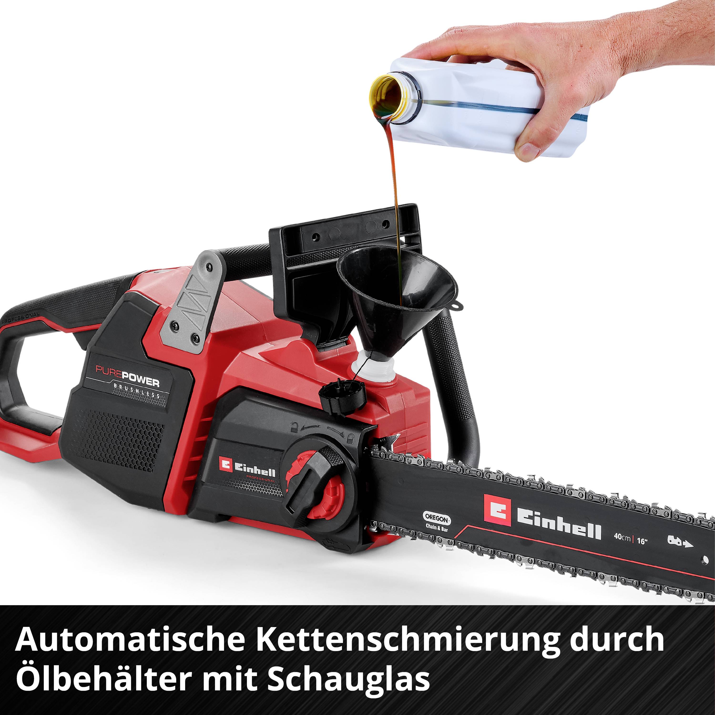 A red chainsaw is being filled with oil. Text: 'Automatic chain lubrication via oil tank with sight glass'