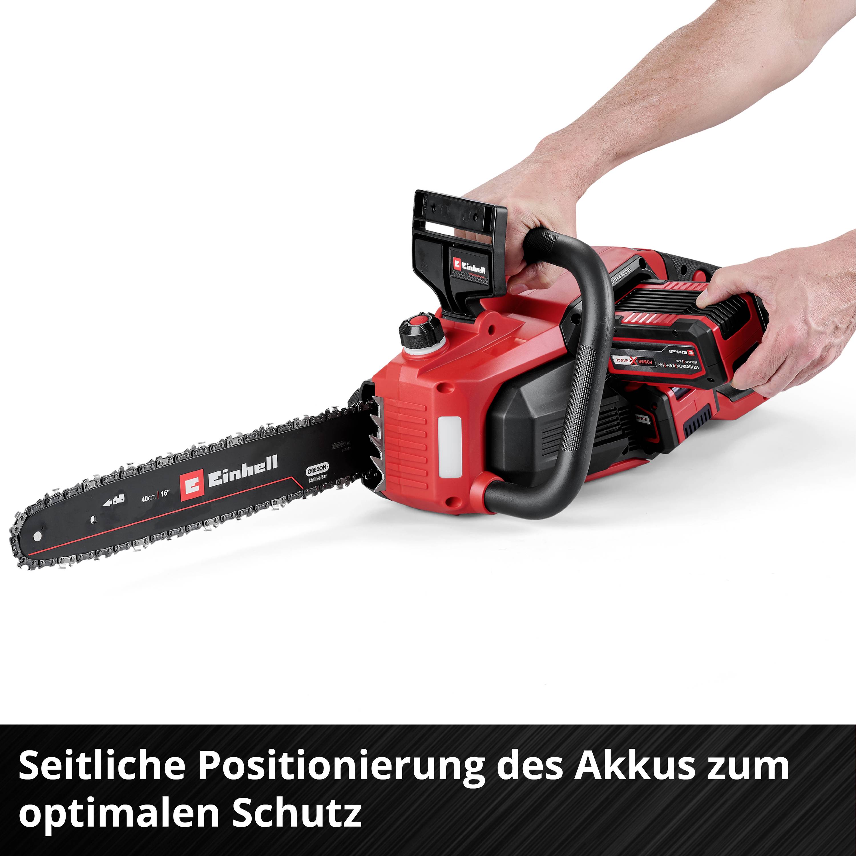 'A person is holding a red chainsaw; side positioning of the battery for optimal protection is highlighted.'