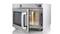 A silver microwave with an open door shows its interior. Numbered buttons and a start button are located at the top.