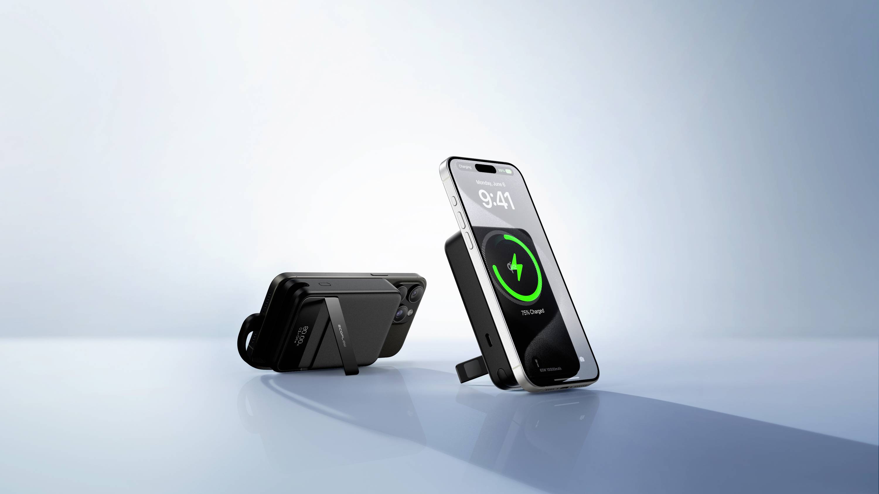 A smartphone is charging wirelessly on a charging pad. The screen displays 9:41 and a charging symbol. Another charging pad is visible in the background.