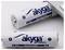 Two white AA alkaline batteries by the brand 'akyga', one lying flat, the other partially inserted into a device.