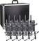 Six portable radios with antennas and earpieces are placed in front of a large, black case.