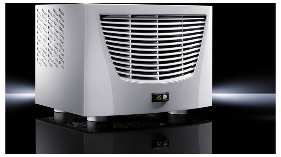 A compact, silver air cooler on a black surface, with a digital temperature display, showing '35'. Ventilation slots at the front and sides.