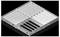 A white, square plastic module with multiple compartments, shown on a black background. The module displays various compartment shapes.