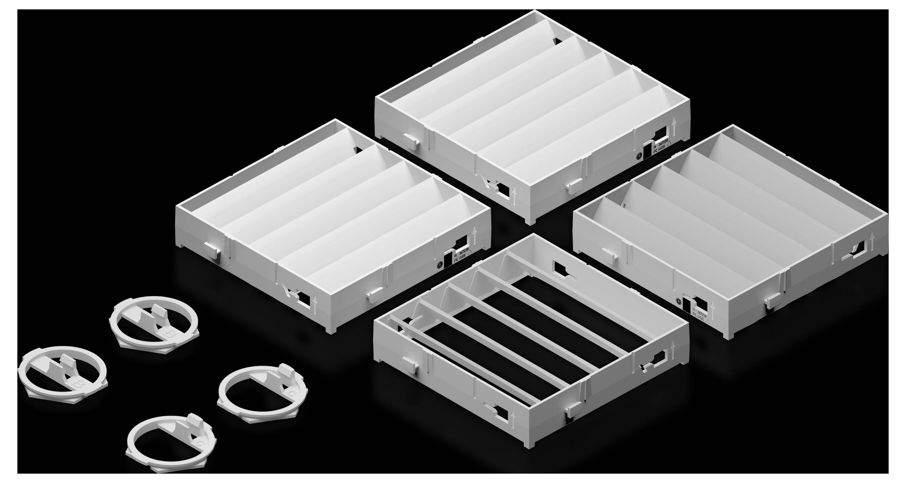 Several white, rectangular plastic casings and round clips on a black background, arranged in a diagonal pattern.