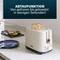 A toaster with the inscription 'DEFROST FUNCTION - From frozen to toasted in just seconds!' An avocado lies on the kitchen worktop.