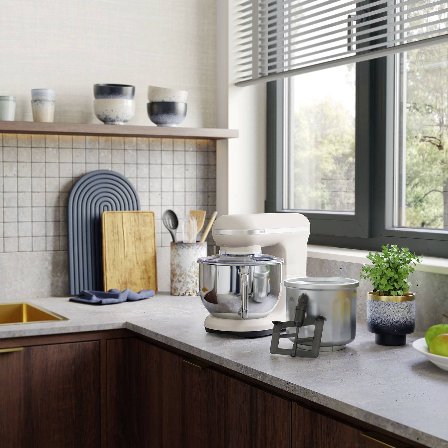 Kitchen worktop with a mixer and accessories, saucepans on shelves and a window with a view of greenery. Cosy kitchen scene.