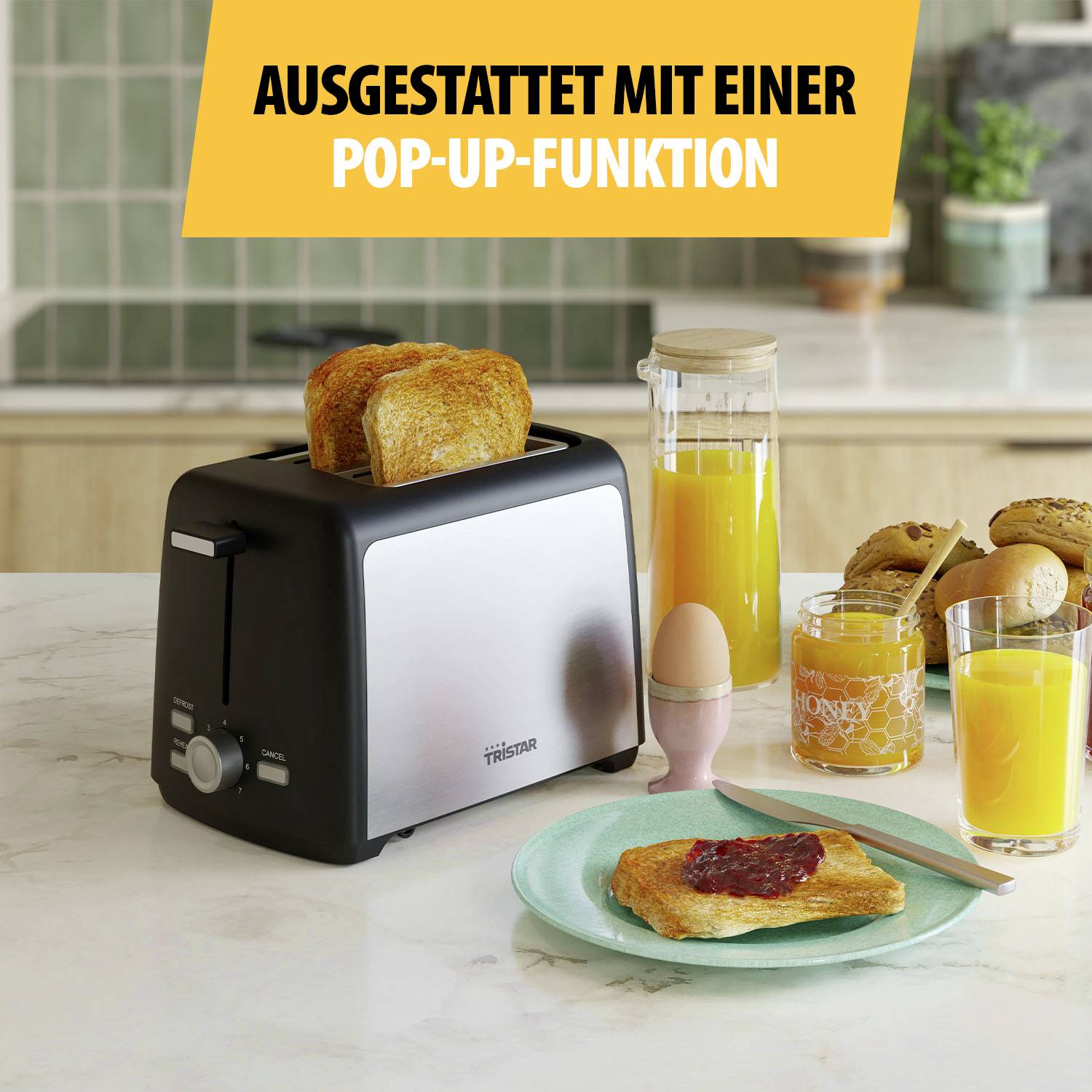 A toaster with two browned toast slices, surrounded by orange juice and a jam jar on a breakfast table.