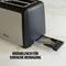 Toaster with removable crumb tray for easy cleaning, Text: 'Crumb tray for easy cleaning'