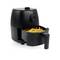 A black air fryer with an open basket filled with chips. At the top, there is a rotary knob for temperature control.