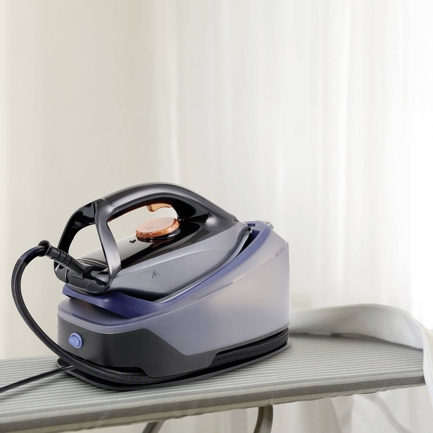 An iron on an ironing board, ready for use.