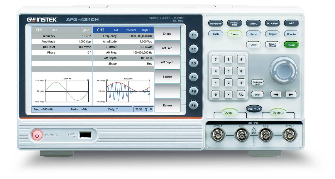 A function generator with a digital display shows frequencies, amplitudes, and waveforms. Control knobs and connectors on the side.
